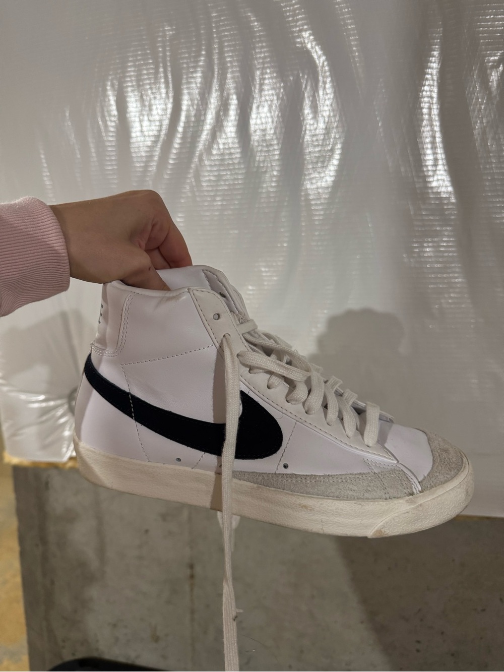Nike White High-Top Sneakers with Black Swoosh